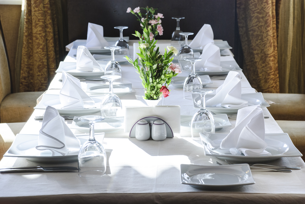 Table set with white restaurant linens, Wilkins Linen